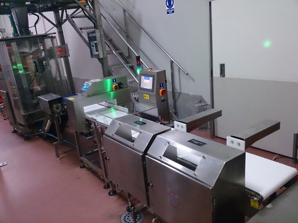 Checkweigher and metal detector installed on a packaging line