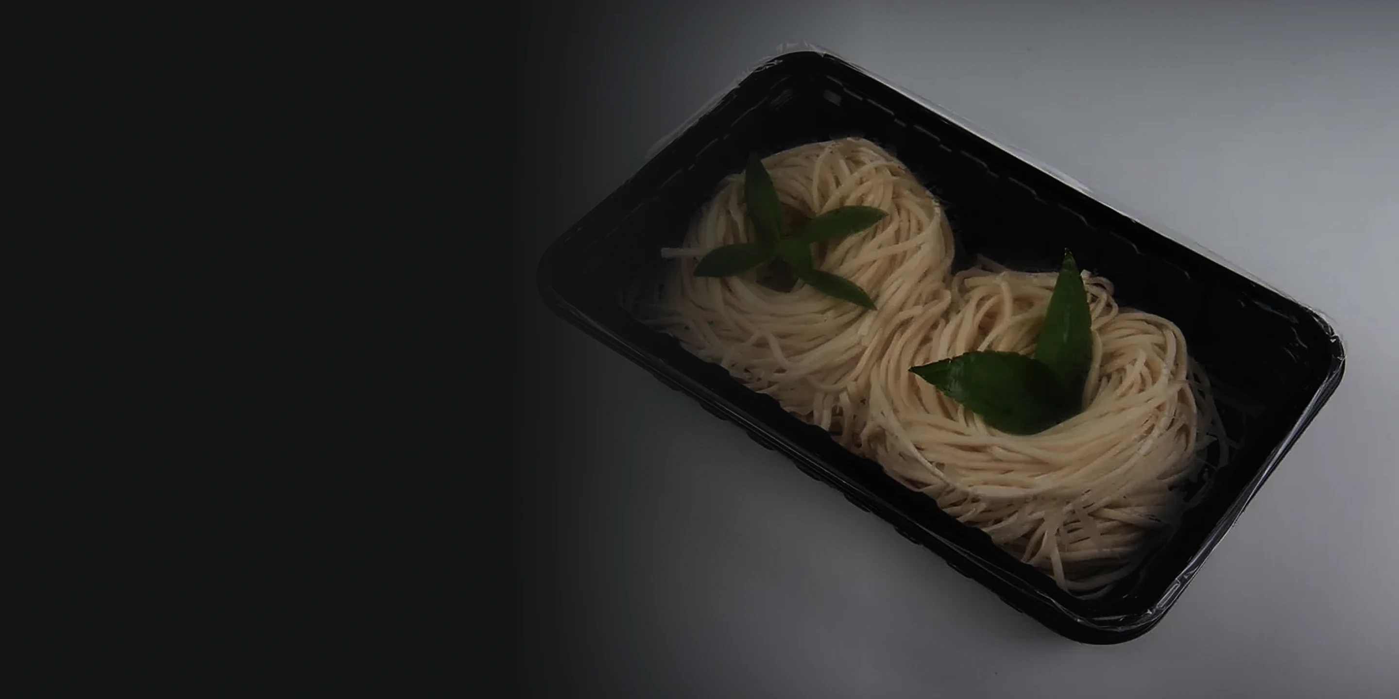 Sealed tray of noodles