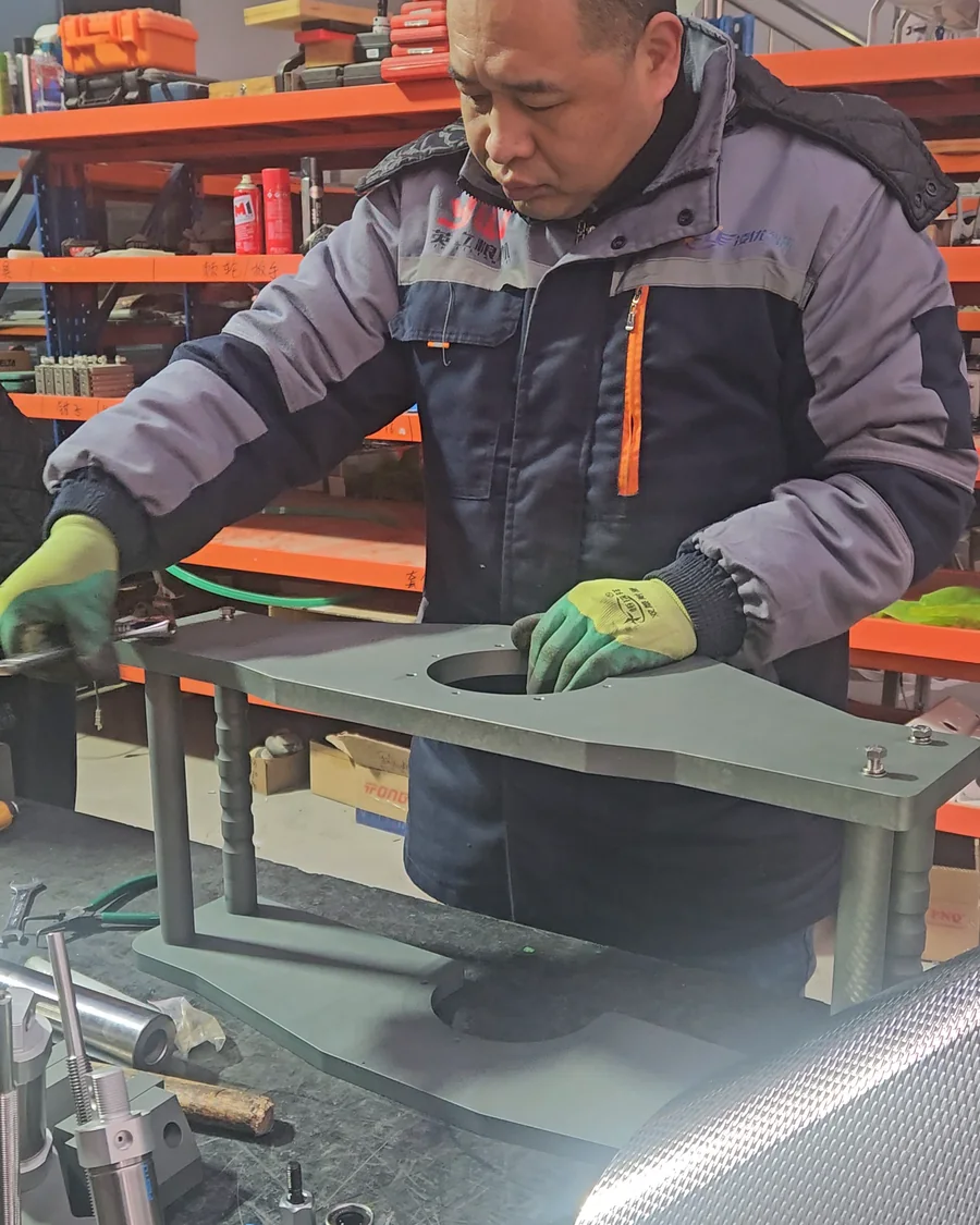 Assembling a machine part at the bench
