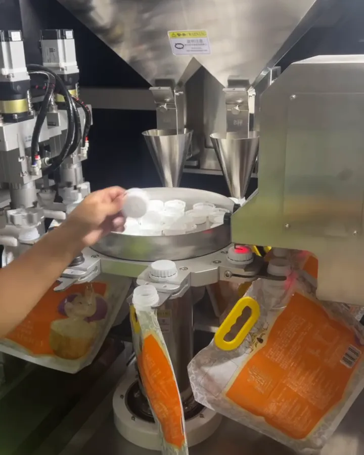 Spouted pouches loaded into a Wide-Spout filler
